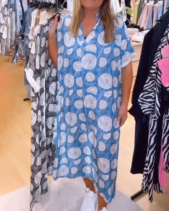 Kleid mit V-Ausschnitt und Kreismuster