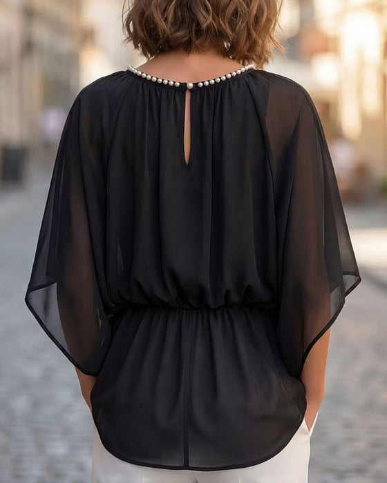 Einfarbige Bluse Mit Fledermausärmeln Und Taillierter Taille
