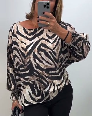 Lässige bluse mit rundhalsausschnitt und laternenärmeln im zebra-print