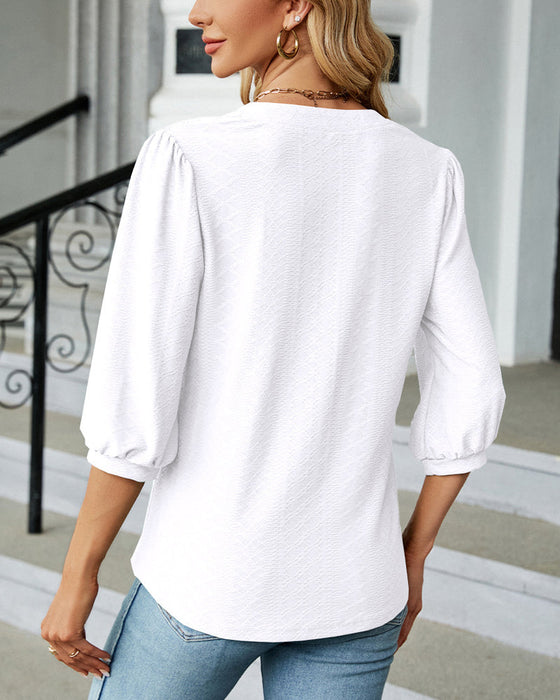 Einfarbige Jacquard-Bluse mit V-Ausschnitt