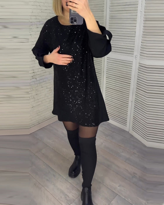 Kleid mit Pailletten und gerüschten Ärmeln