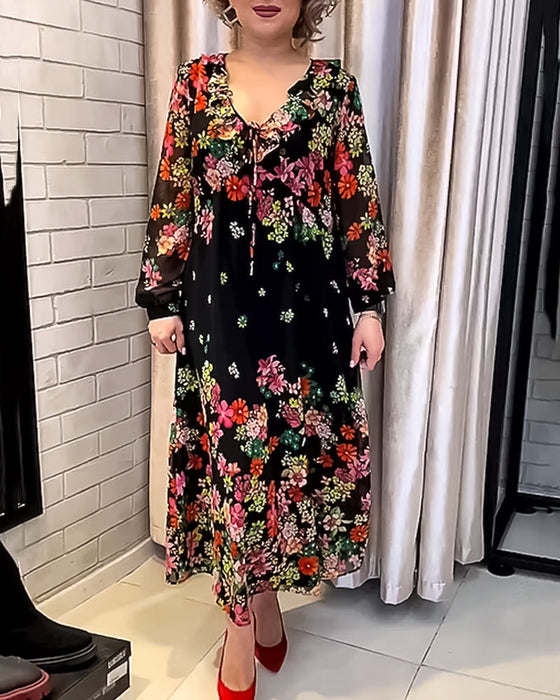 Elegantes Kleid mit Blumendruck und V-Ausschnitt